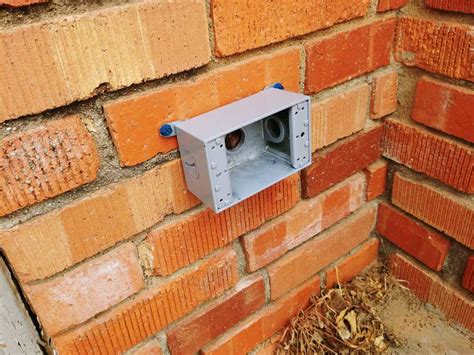 drilling out electrical box in brick|external outlet for brick wall.